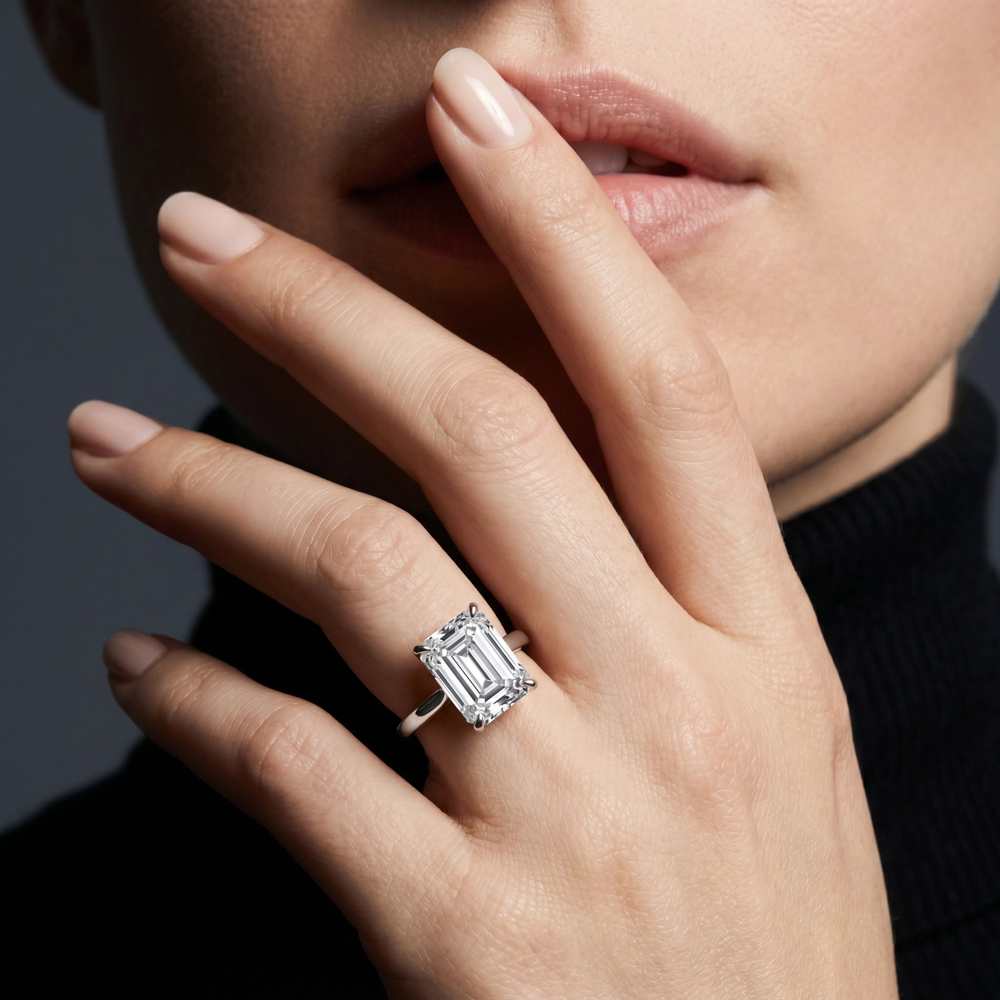 Emerald cut white gold ring on hand
